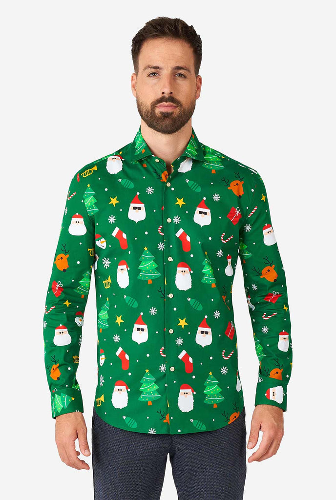 Man wearing green Christmas dress shirt with Christmas icons