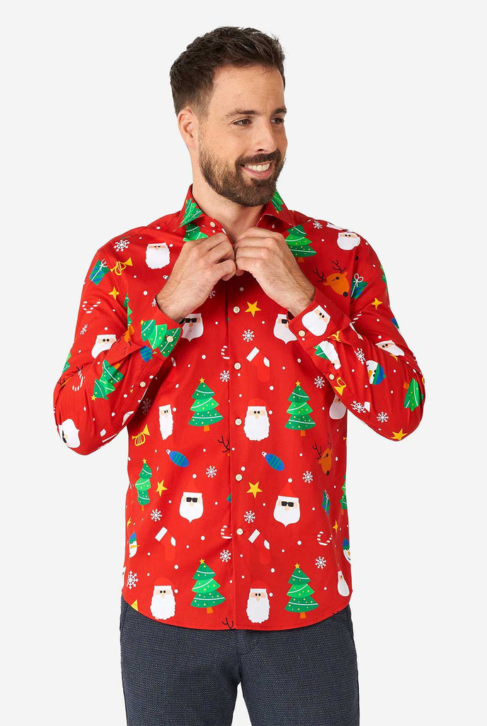 Man wearing red Christmas dress shirt with Christmas icons