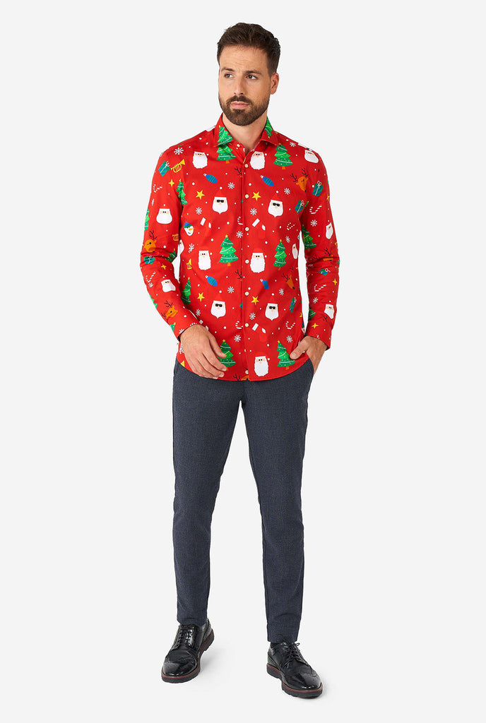 Man wearing red Christmas dress shirt with Christmas icons