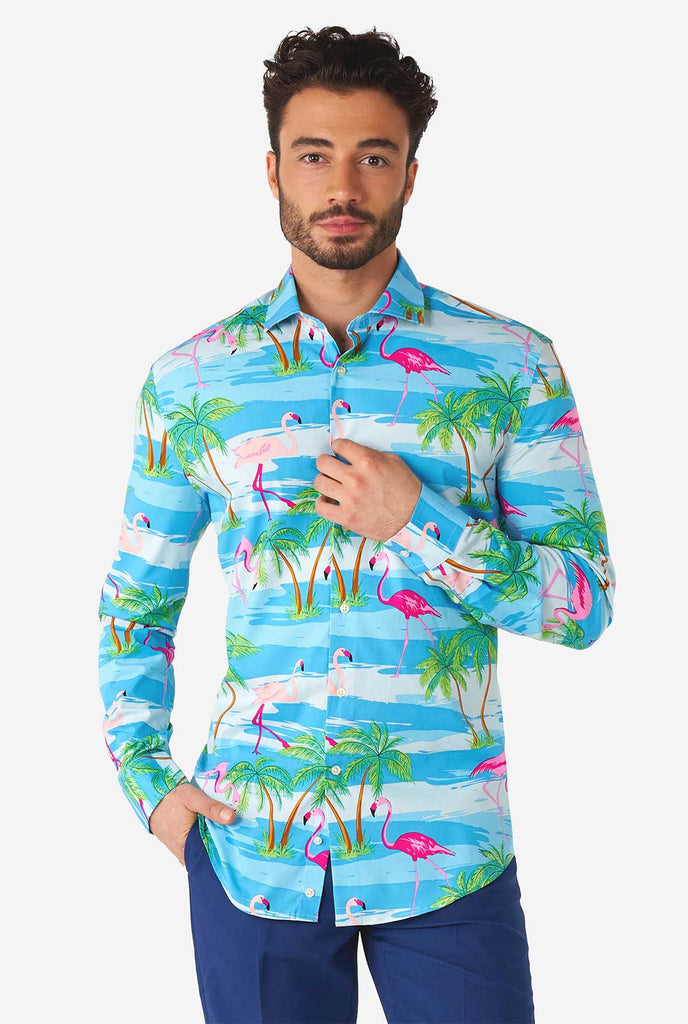 Man wearing Hawaiian dress shirt with tropical flamingo print