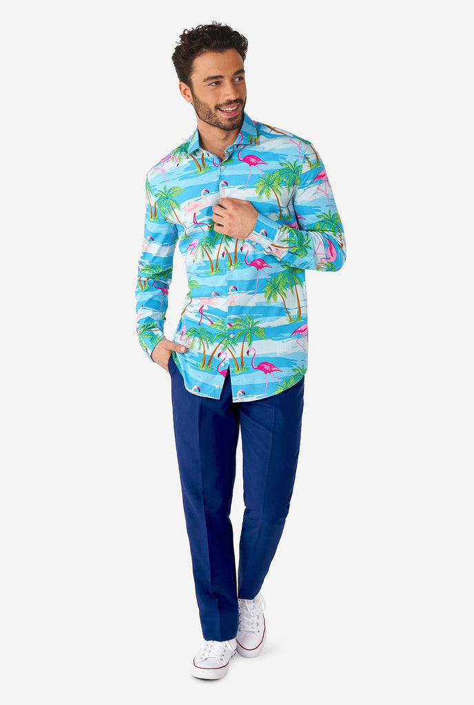 Man wearing Hawaiian dress shirt with tropical flamingo print