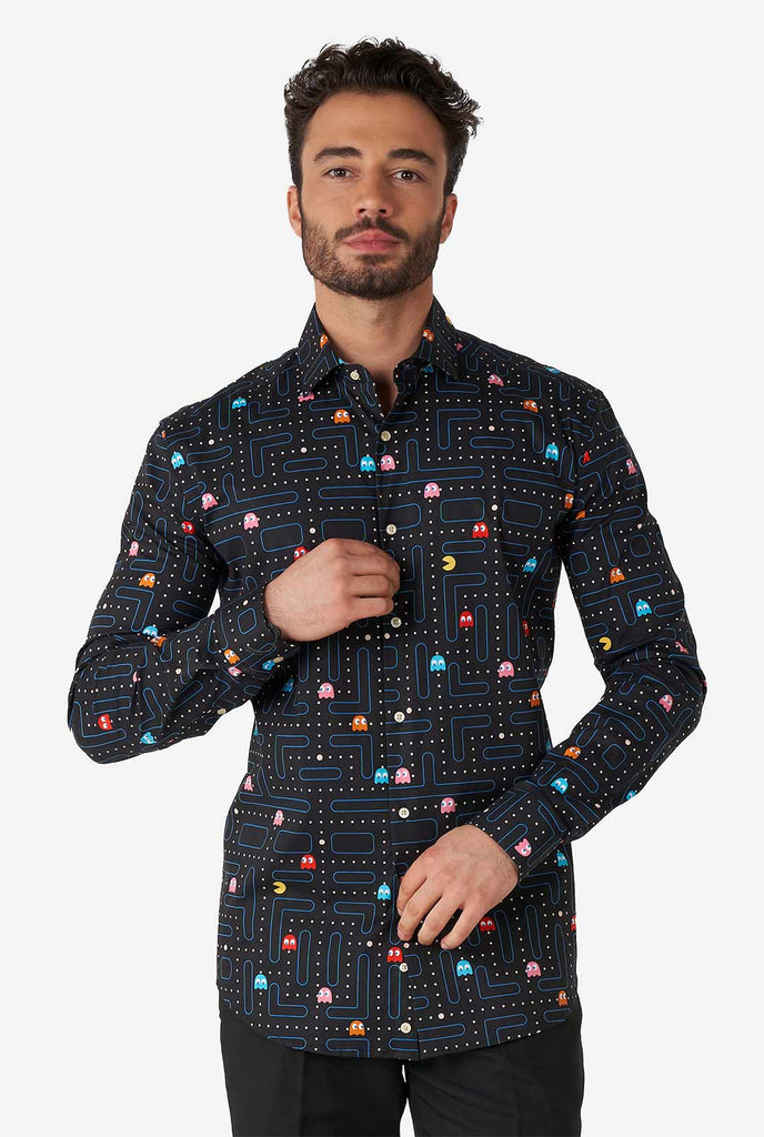 Man wearing black dress shirt with Pac-Man print