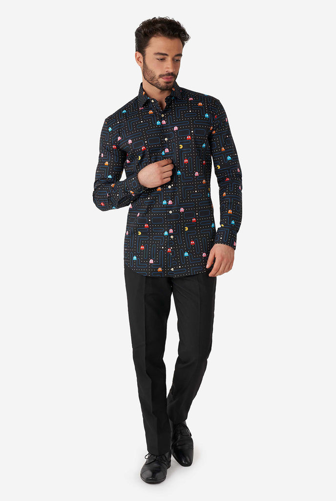 Man wearing black dress shirt with Pac-Man print