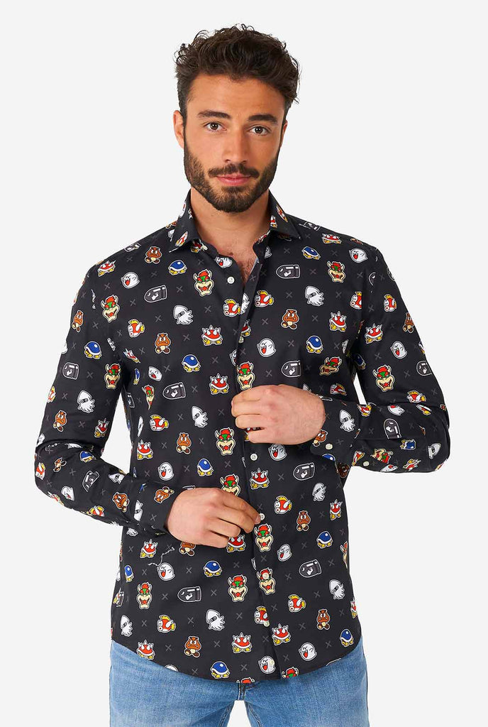 Man wearing black dress shirt with Super Mario bad guys icons