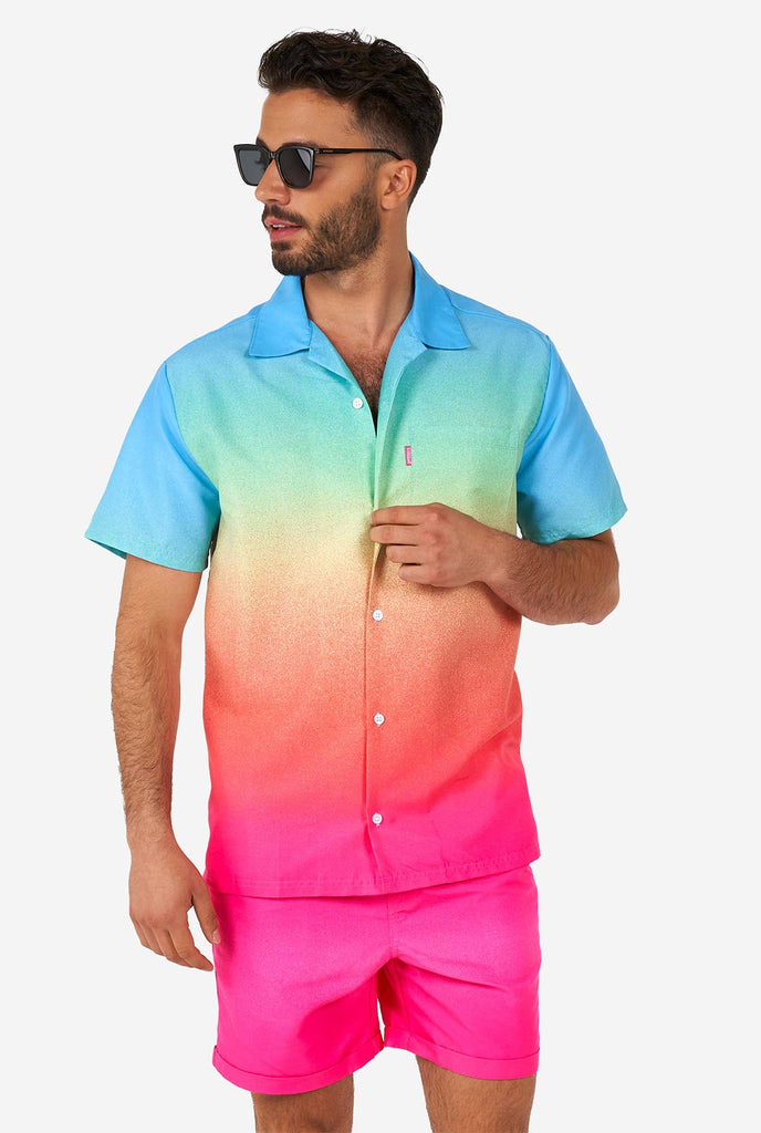 Man wearing colorful summer shorts and shirt