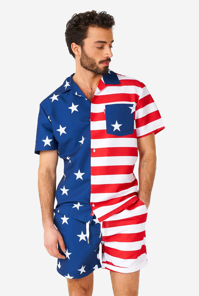 Man wearing summer outfit, consisting of shirt and shorts, with USA flag print