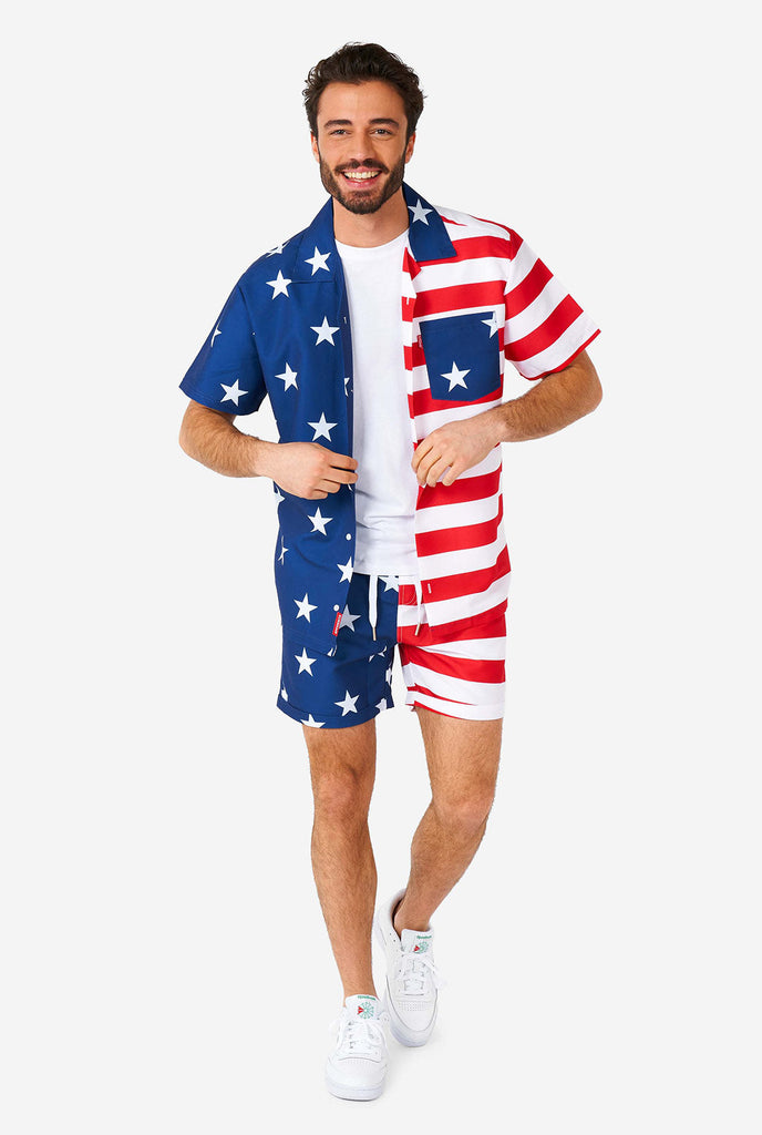 Man wearing summer outfit, consisting of shirt and shorts, with USA flag print