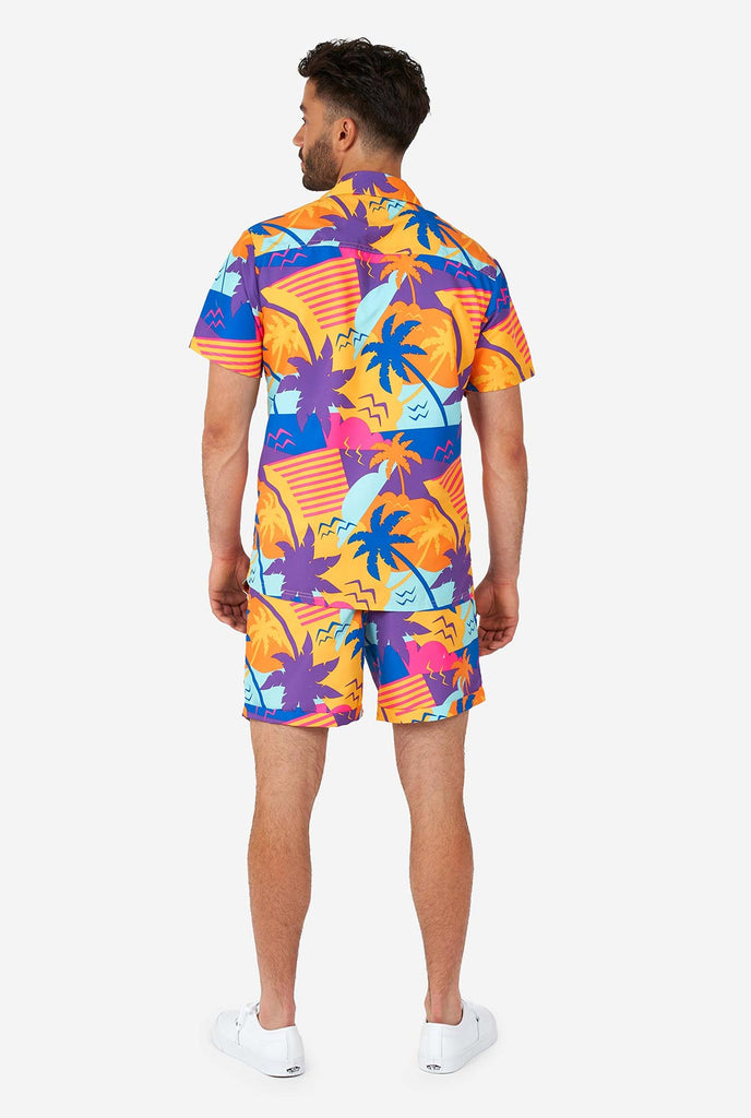 Man wearing colorful summer shorts and shirt