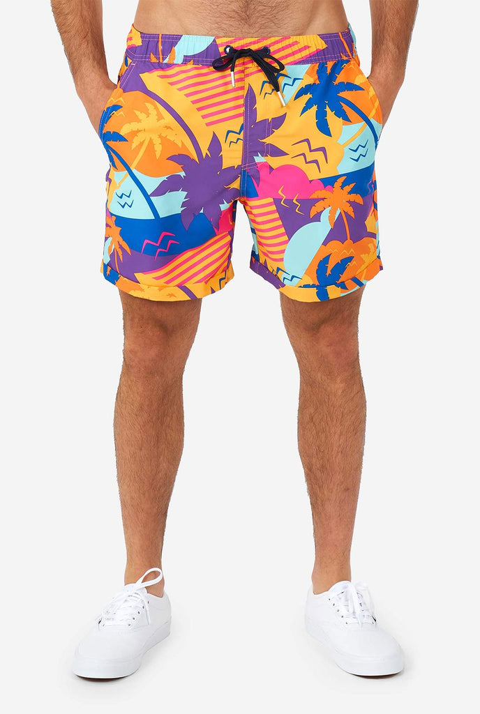 Man wearing colorful summer shorts and shirt