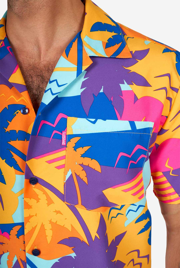 Man wearing colorful summer shorts and shirt