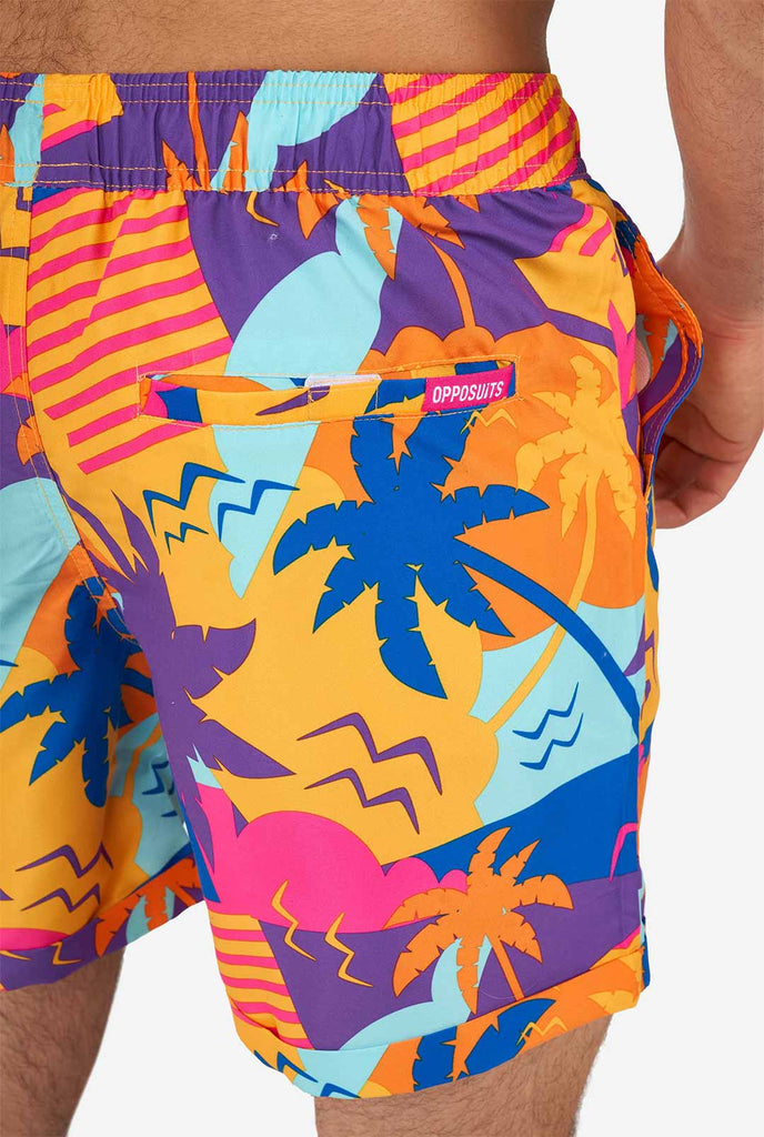 Man wearing colorful summer shorts and shirt