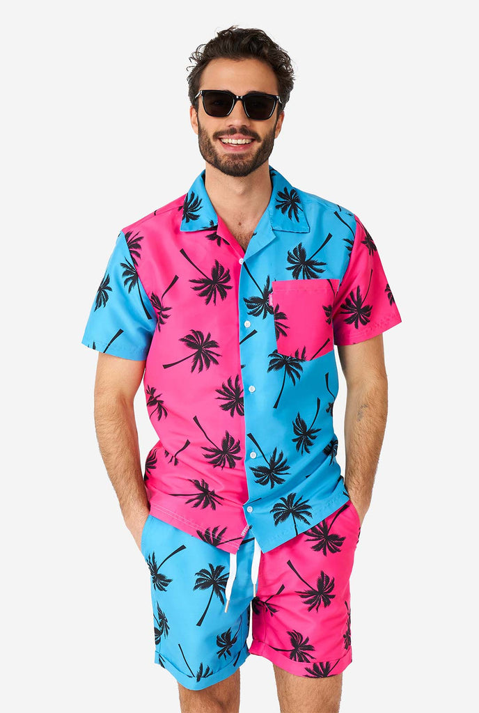 Man wearing summer set consisting of shorts and shirt