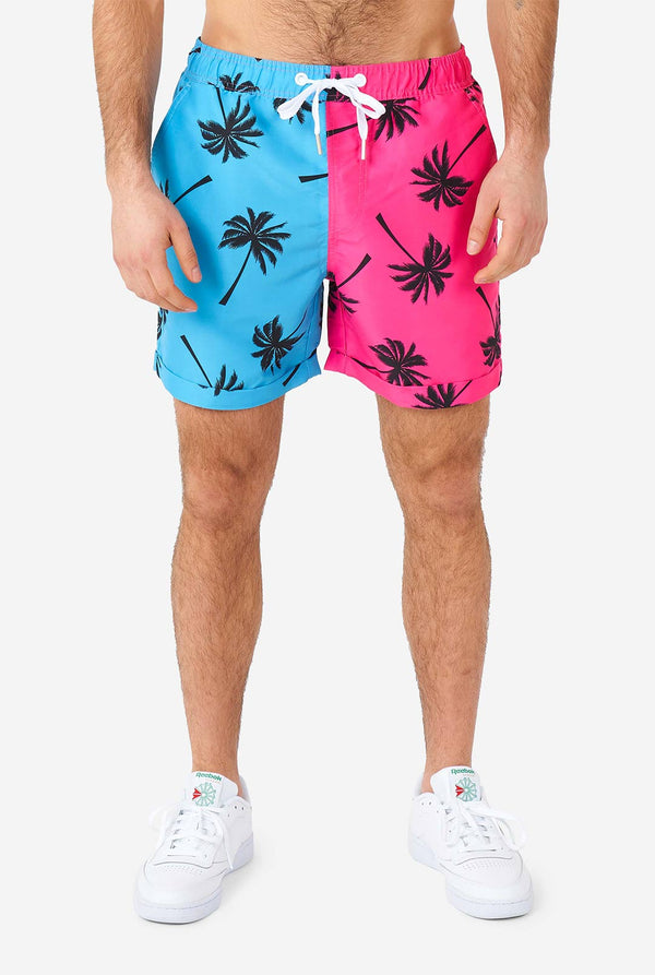 Man wearing summer set consisting of shorts and shirt