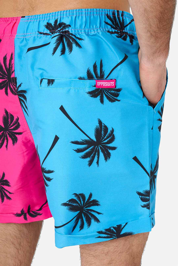 Man wearing summer set consisting of shorts and shirt
