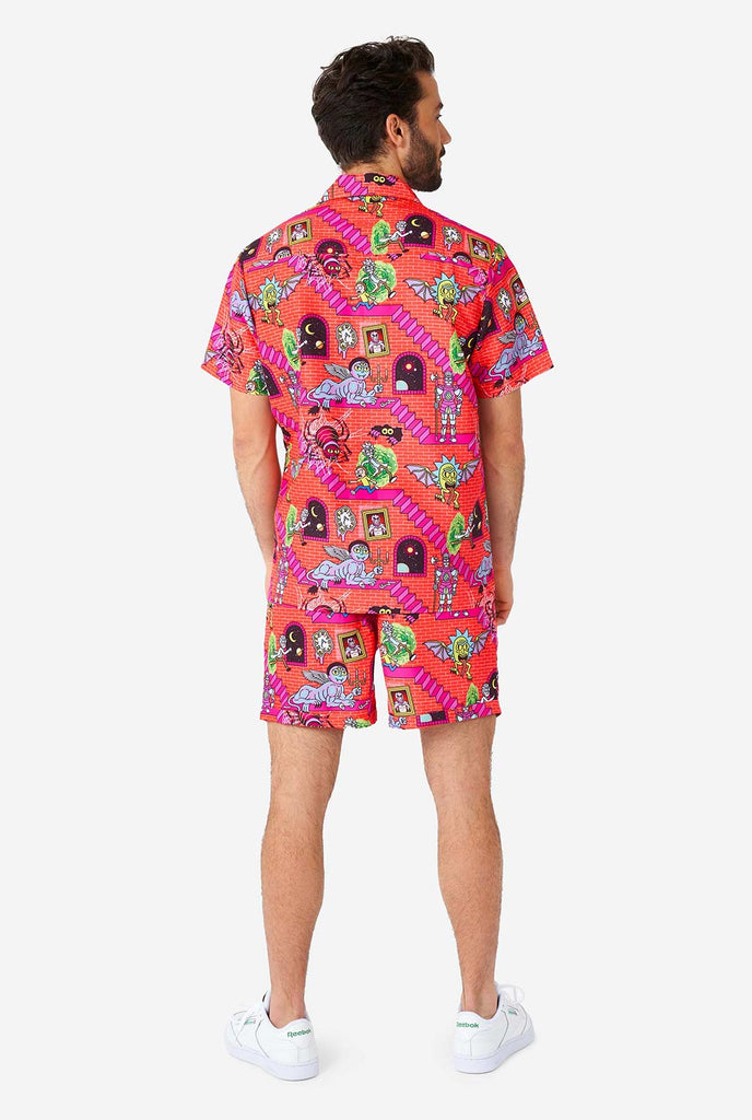 Man wearing summer outfit, consisting of short and shirt, with Rick and Morty print
