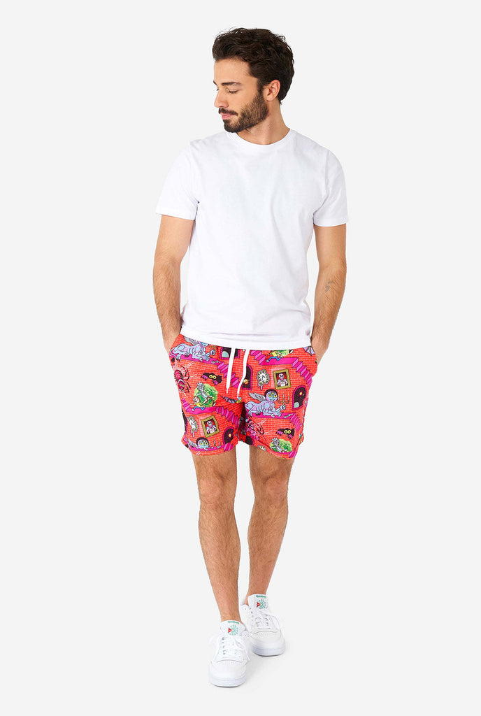 Man wearing summer outfit, consisting of short and shirt, with Rick and Morty print