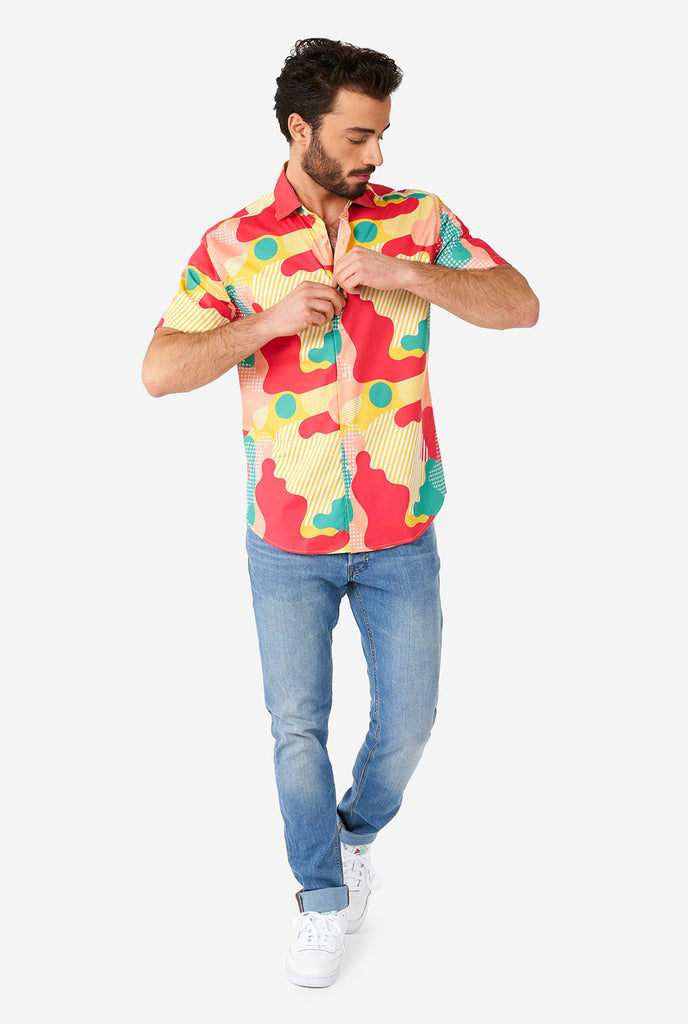 Man wearing summer shirt with colorful camouflage print