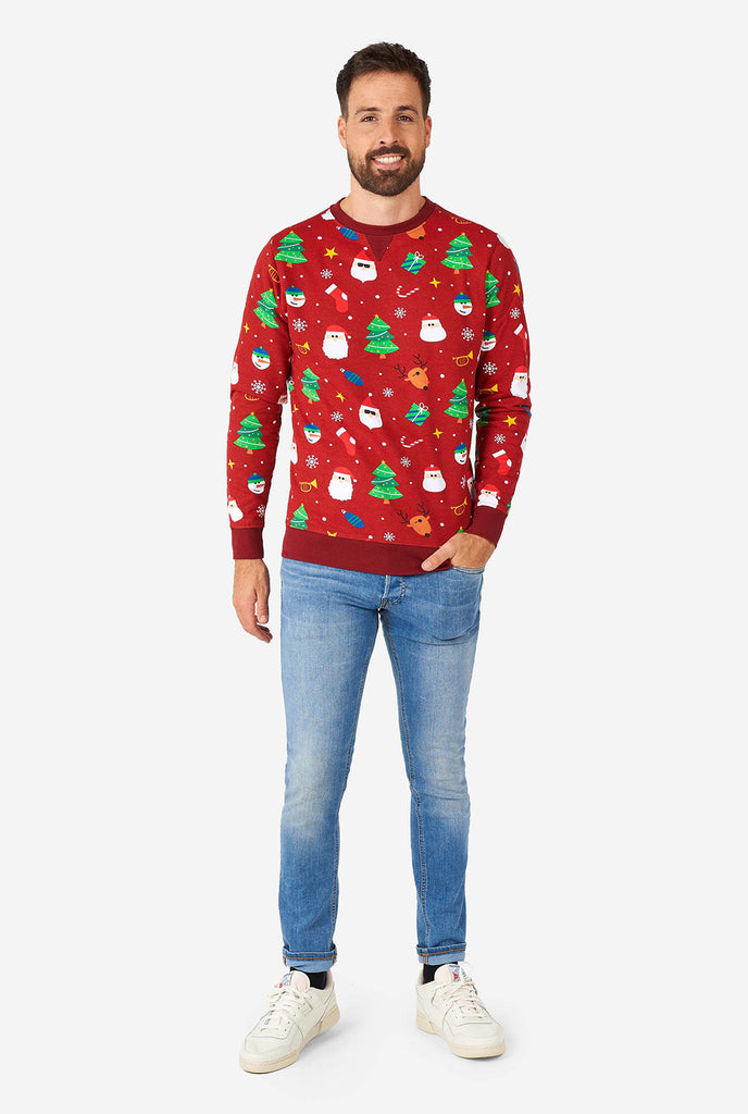 Man wearing red Christmas sweater with Christmas icons