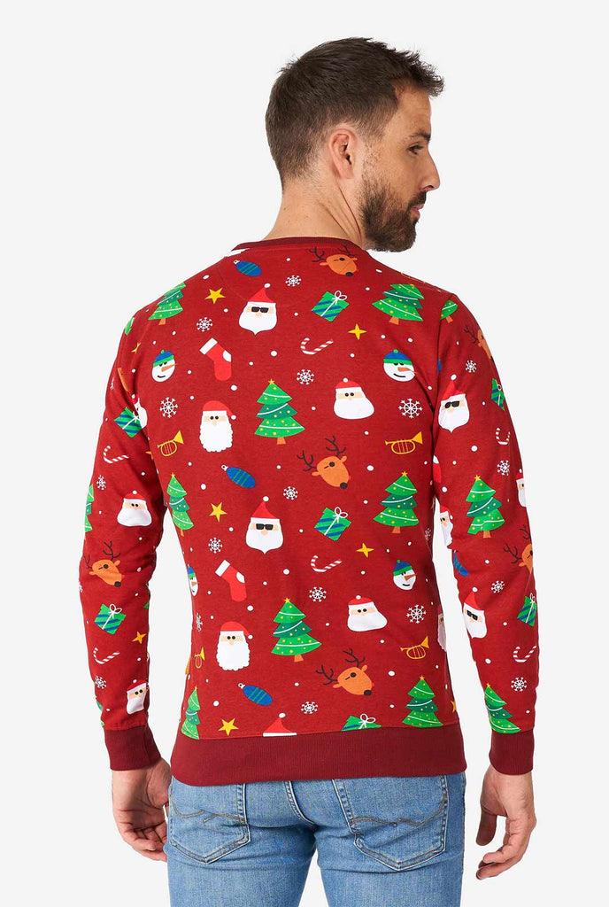 Man wearing red Christmas sweater with Christmas icons