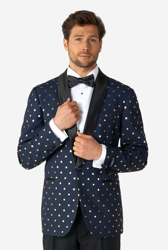 Man wearing blue tuxedo with golden dots