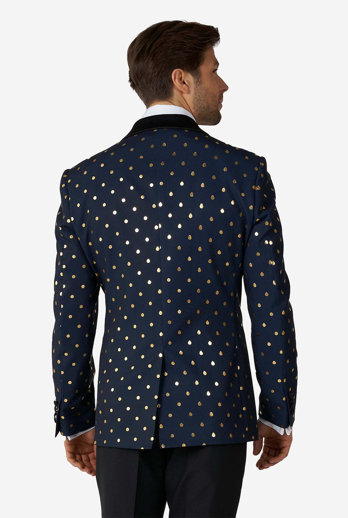 Man wearing blue tuxedo with golden dots