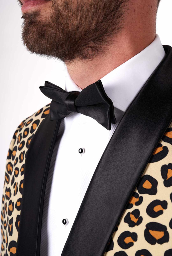 Man wearing tuxedo with jaguar print jacket