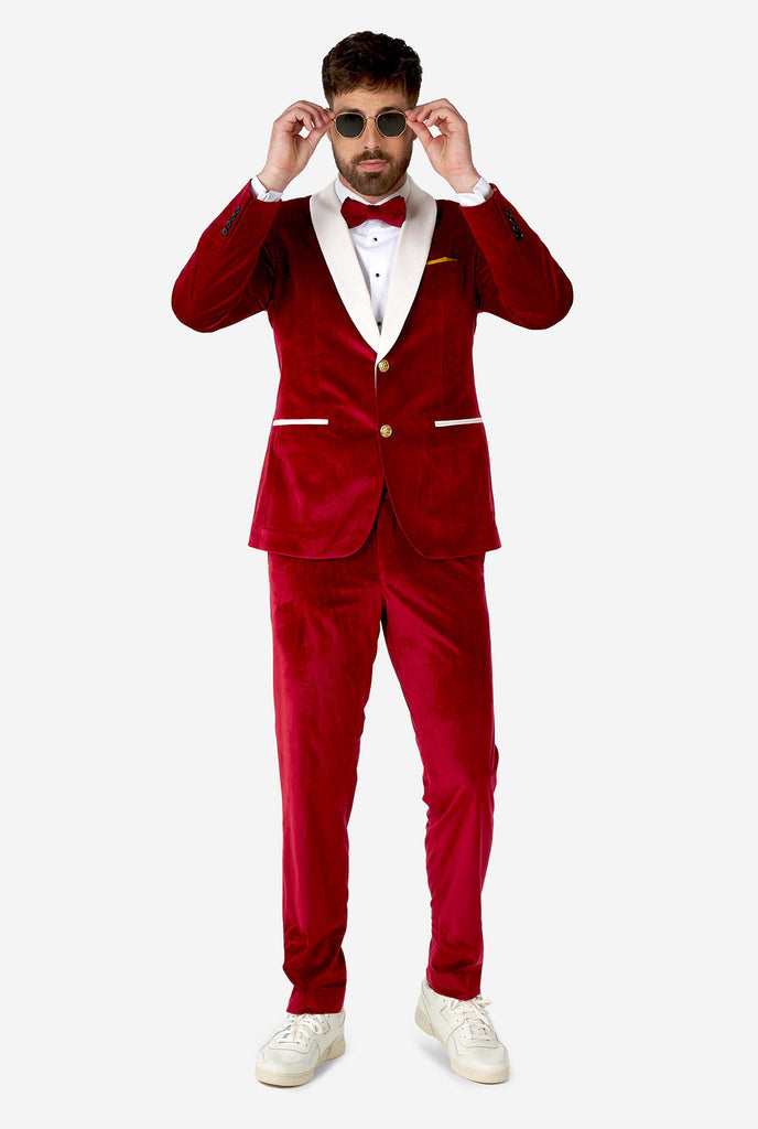 Man wearing red and white santa Christmas tuxedo