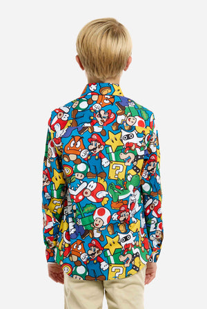Image of teen wearing a Super Mario all over print shirt. Main color is blue, but there is also yellow, red and white.
