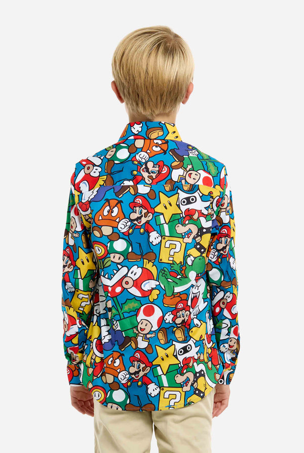 Image of teen wearing a Super Mario all over print shirt. Main color is blue, but there is also yellow, red and white.