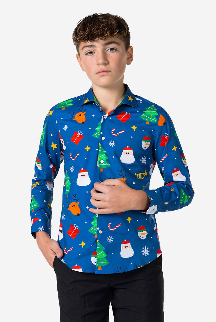 Teen wearing blue dress shirt with Christmas print