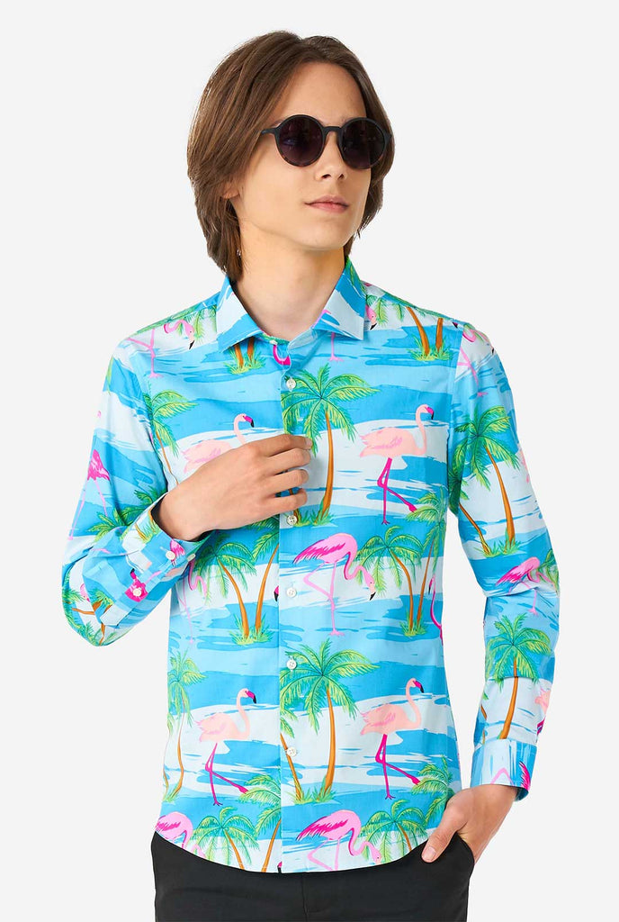 Teen wearing Hawaiian dress shirt with tropical flamingo shirt