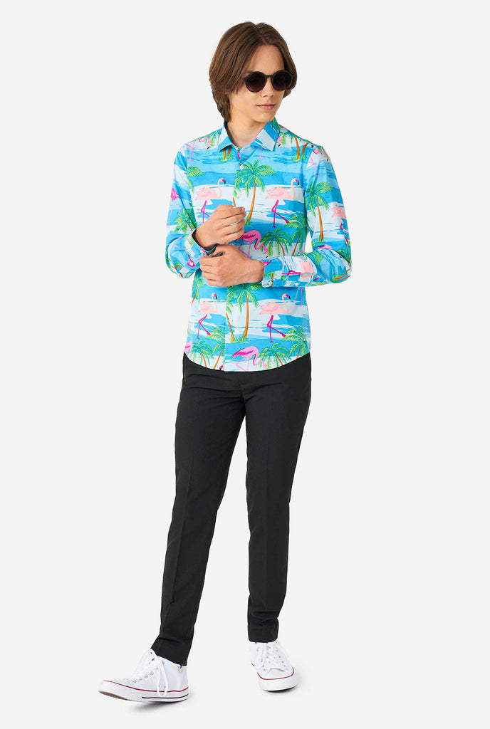 Teen wearing Hawaiian dress shirt with tropical flamingo shirt