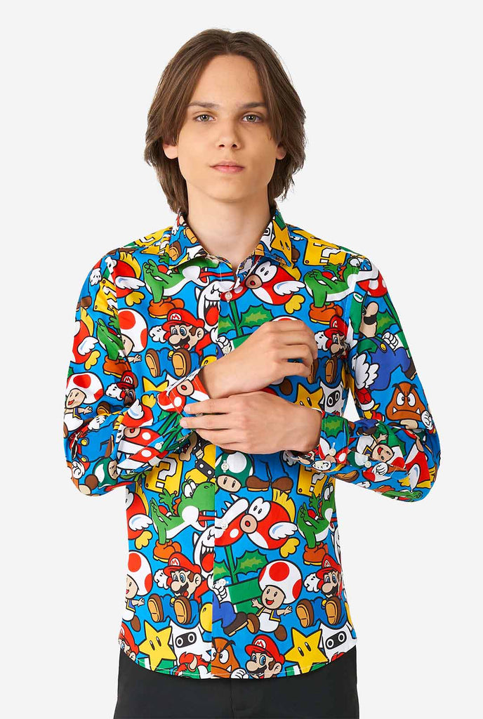 Teen wearing dress shirt with Super Mario print