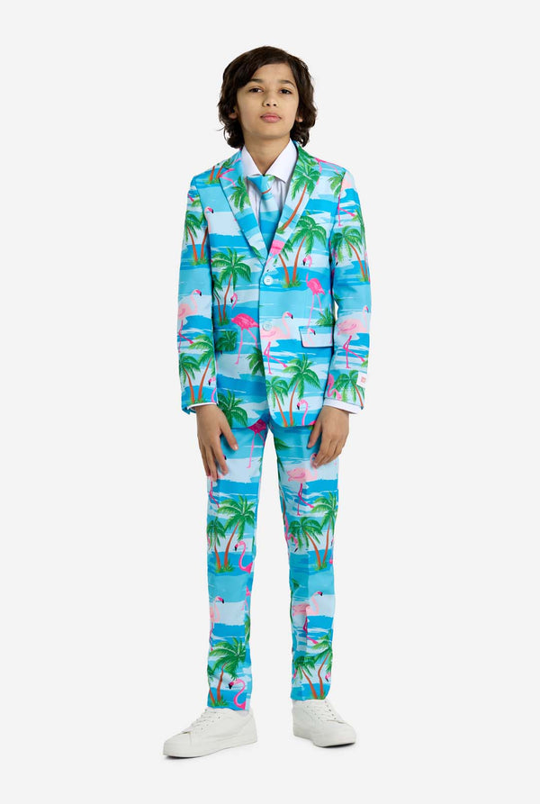 Child wearing a colorful tropical-themed suit on a white background