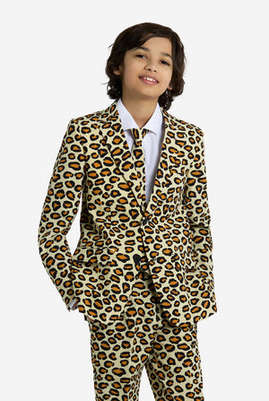 Child wearing a leopard print suit on a white background