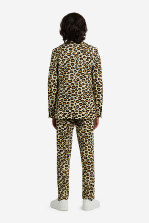 Person wearing a leopard print suit on a white background