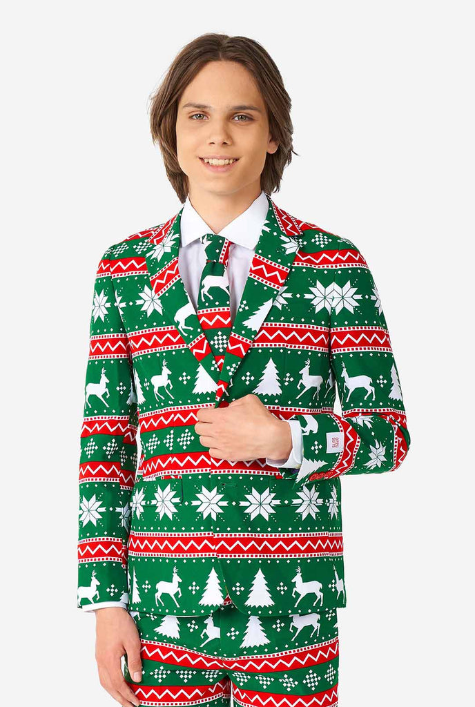 Teen wearing green formal Christmas suit