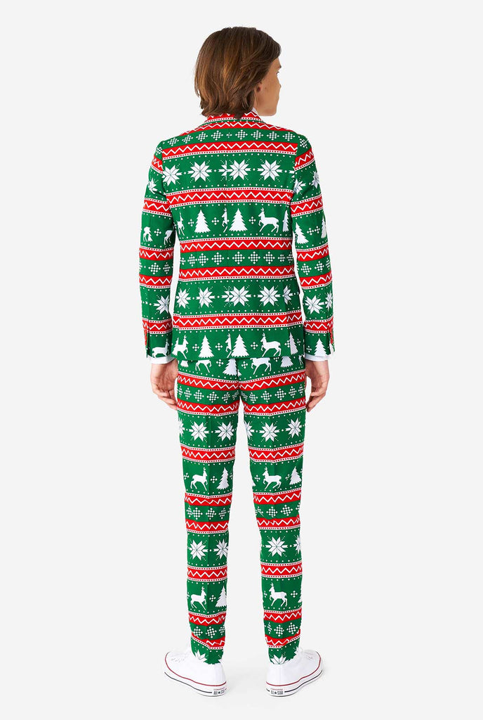 Teen wearing green formal Christmas suit