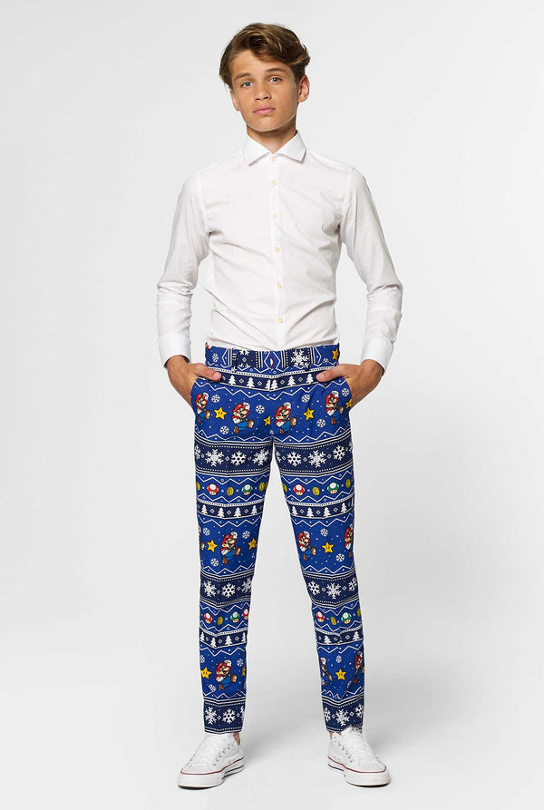 Teen wearing blue Christmas suit with Super Mario print