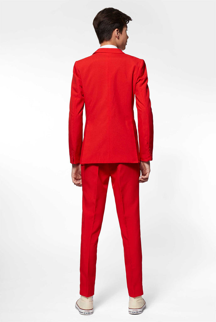 Teen wearing red formal suit