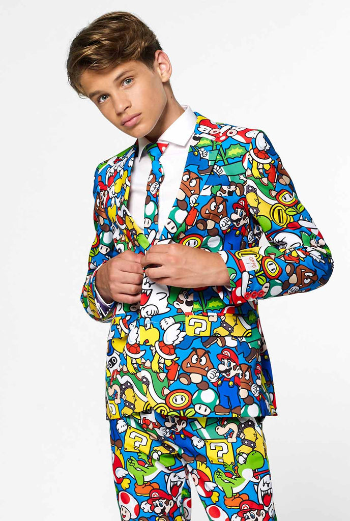 Teen wearing formal suit with colorful Super Mario print