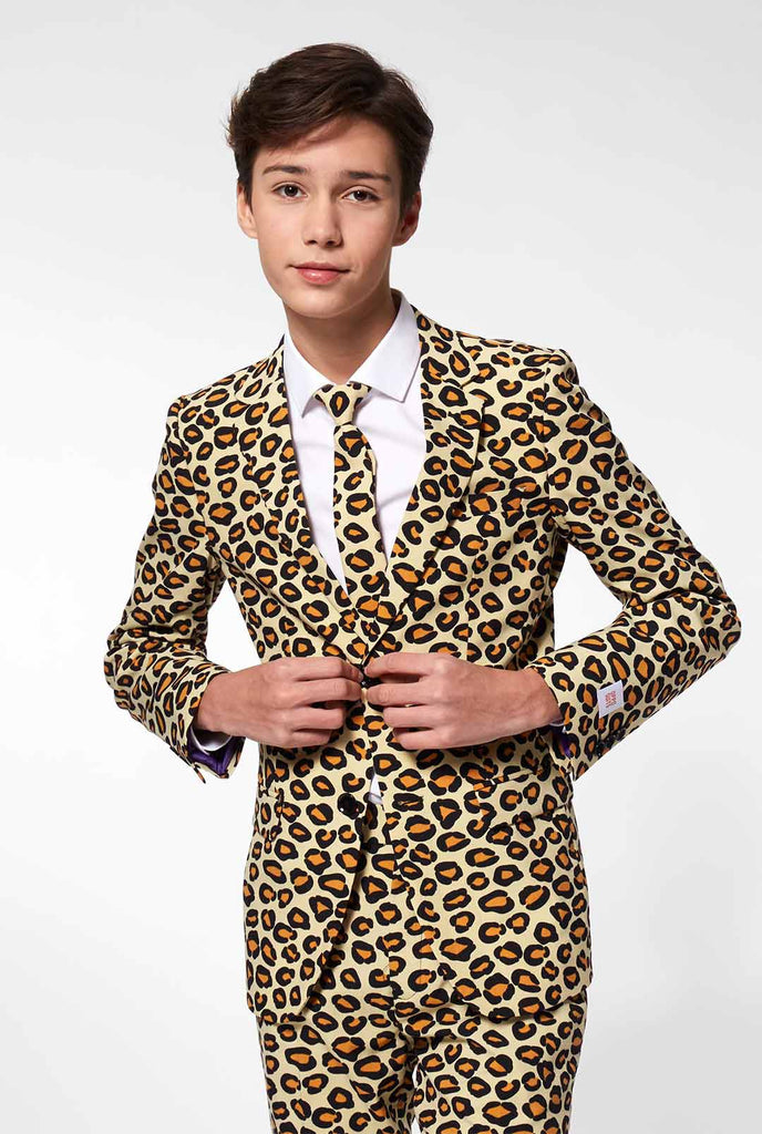 Teen wearing formal suit with panther print