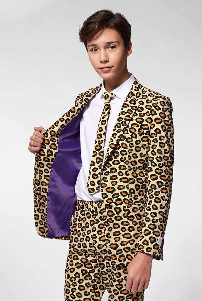 Teen wearing formal suit with panther print