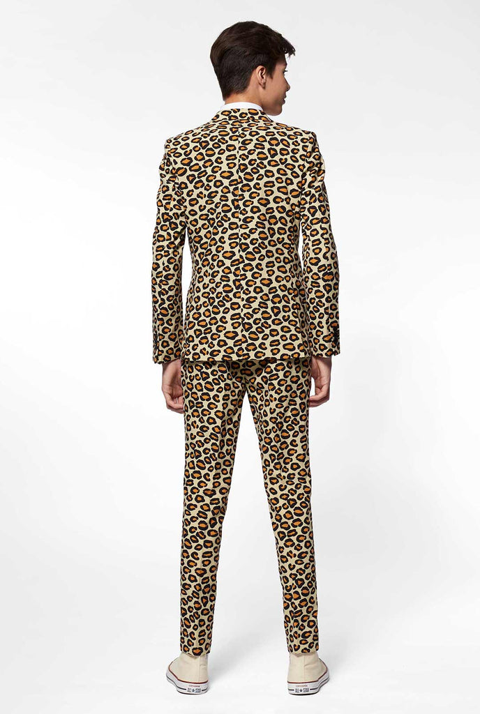 Teen wearing formal suit with panther print