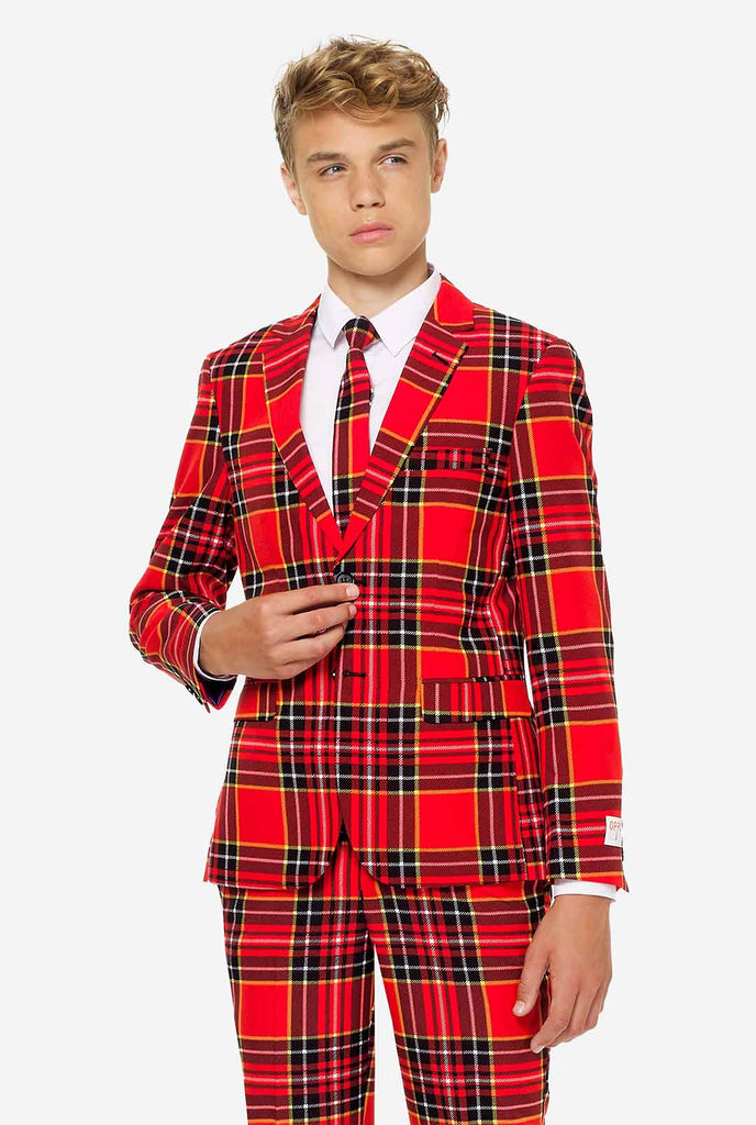 Teen wearing red tartan Christmas suit