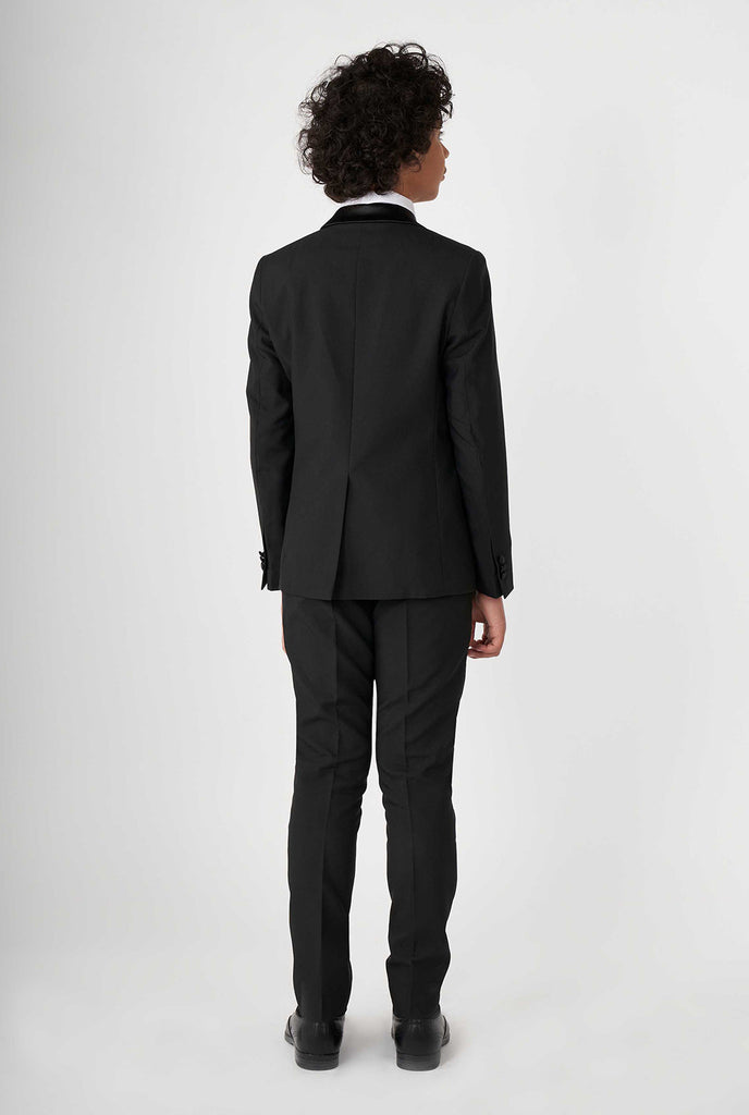 Teen wearing black tuxedo