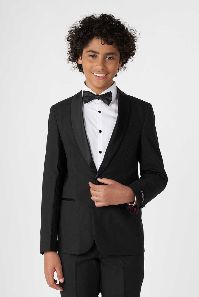 Teen wearing black tuxedo