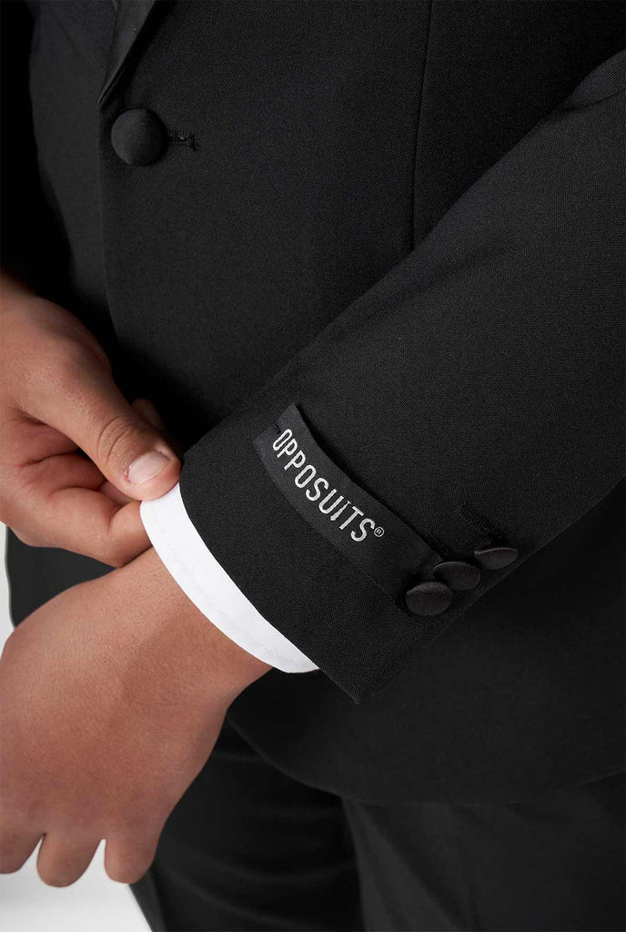 Teen wearing black tuxedo
