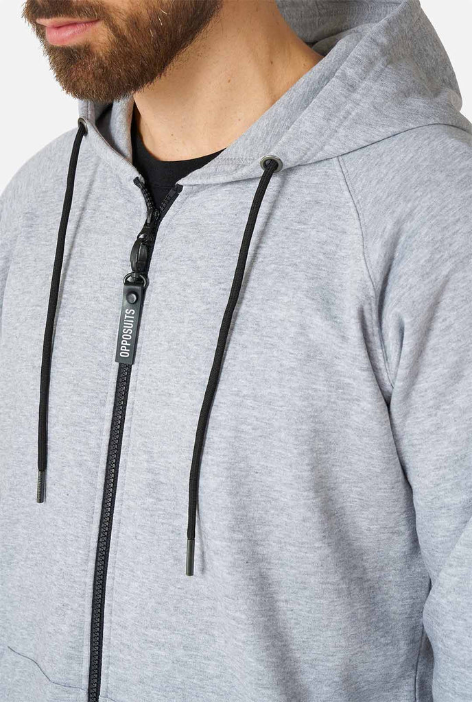Man wearing grey onesie