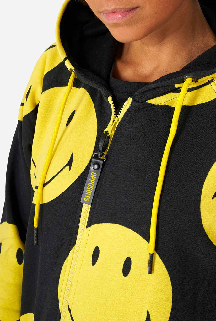 Man wearing black onesie with yellow smiley print
